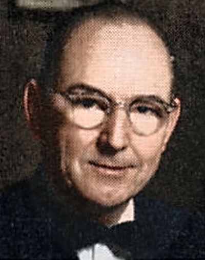 Restored and colorized (AI-assisted); faces are the original photo, colours are a best guess. James Burton Coffman, mid-century press portrait.