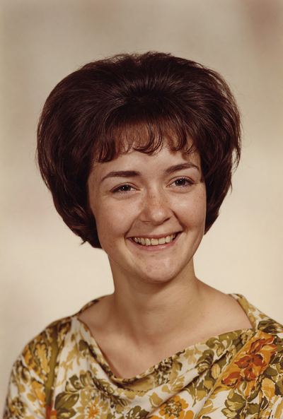 Restored and colorized with AI from the original, c. 1964. Colours are a best guess. Nancy Coffman Proeger, portrait, c. 1964.