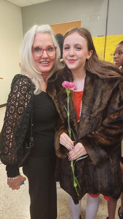 LaVonne Danielson backstage with a young performer