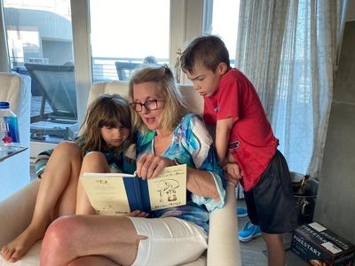LaVonne Danielson reading to two children