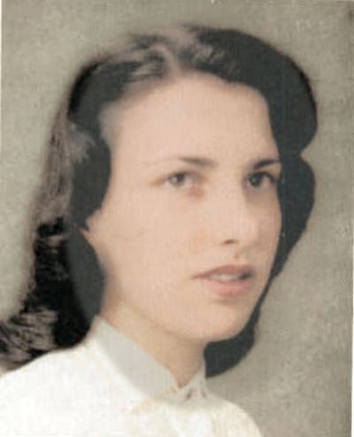 Restored and colorized (AI-assisted); faces are the original photo, colours are a best guess. Nancy A. Proeger, senior portrait, 1955 — George Washington High School yearbook, Guam.