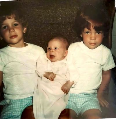 Damon, Tasha and Mark Proeger, with Tasha as a newborn
