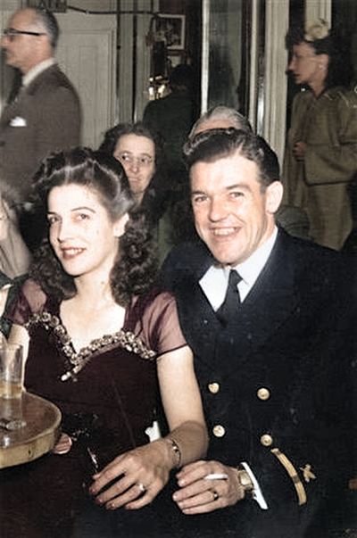 Restored and colorized (AI-assisted); faces are the original photo, colours are a best guess. Earl T. Roberts — c. 1940s.