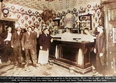 Restored (AI-assisted colour; faces from the original): descreened, cleaned, upscaled 3x and colourized. Coste's saloon, Mission San José — Frank Da Silva Jr (third from left), its speakeasy owner per family; c. 1920–1924 — newspaper clipping annotated 'Grandpa Silva / Mom's Dad'